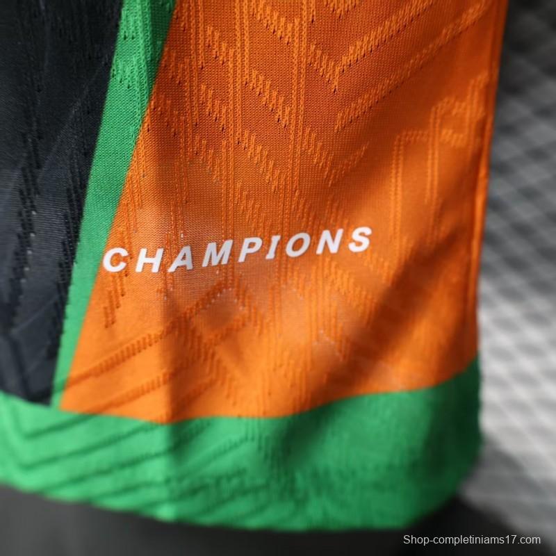 Player Version 2025 Ivory Coast Black with Elephant Graphic and Orange Stripes Jersey
