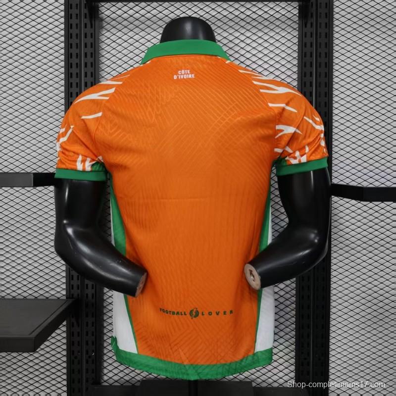 Player Version 2025 Ivory Coast Orange with Elephant Graphic and Green Accents Jersey