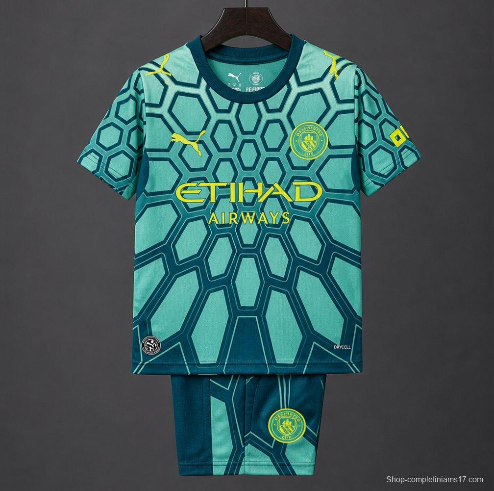 26/27 Kids Manchester City Vibrant Green Goalkeeper Jersey With Dark Blue Geometric Pattern.